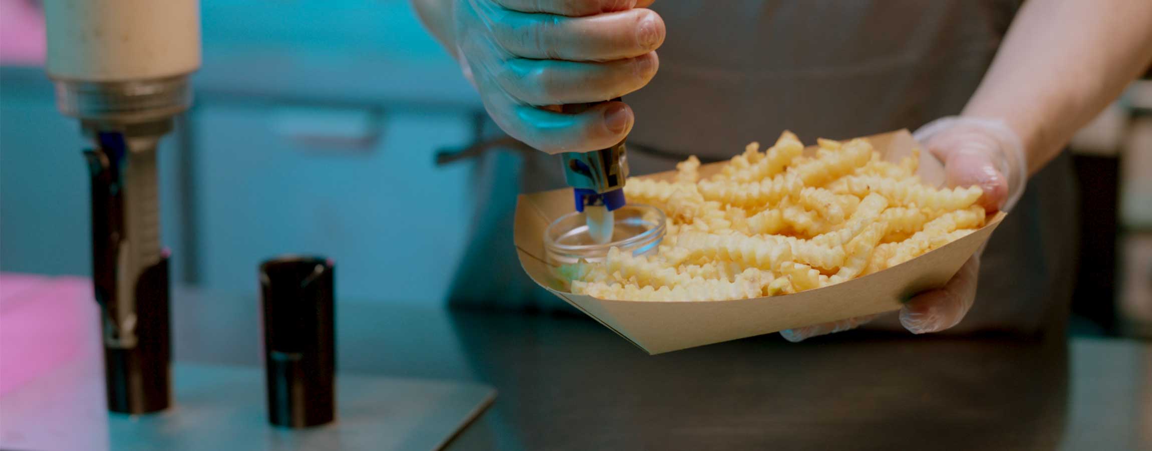Portion Pump MAX in BoH consistent dispensing of mayo on fries